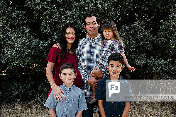 Family of Five Smiling for Camera in San Diego