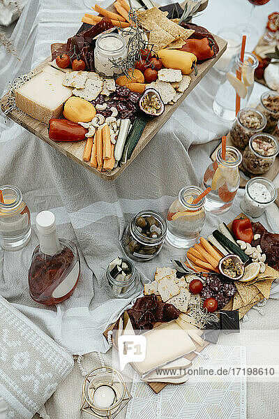 Abundance of food for a picnic on white blanket