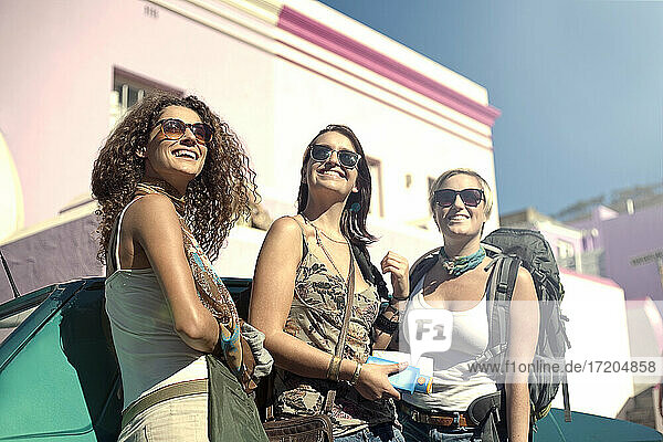 Female friends with backpacks in city on sunny day  Malay Quarter  Cape Town  South Africa