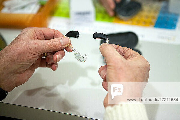 Adjustment of hearing aids at a hearing care professional.