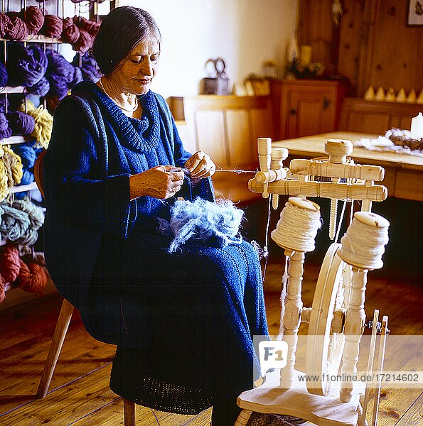 People; Peasant  pure new wool  natural wool  wool  woman with spinning wheel |People; Peasant  pure new wool  natural wool  wool  woman with spinning wheel