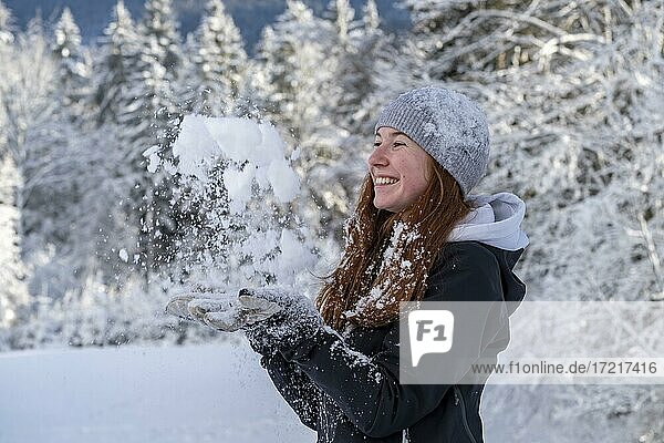 Woman enjoying the snow during winter walk  winter with snow  snowy landscape  Bad Heilbrunn  Upper Bavaria  Bavaria  Germany  Europe