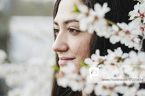 Smiling woman looking away in springtime