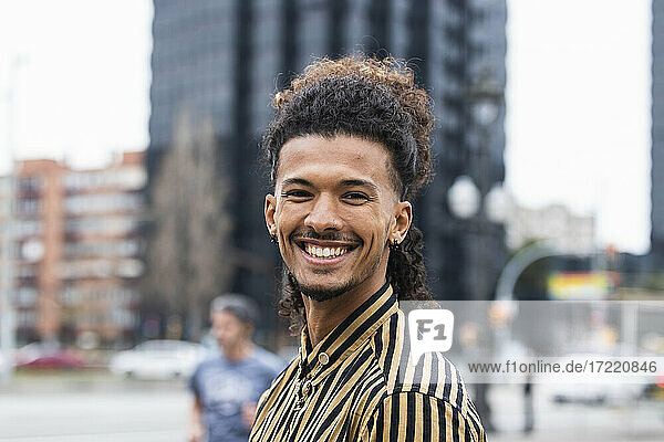 Happy young man in city