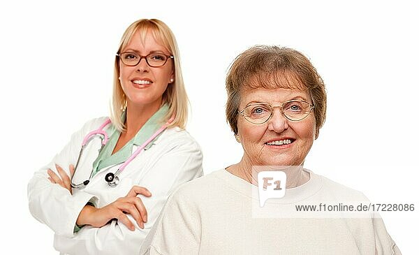 Smiling senior woman with female doctor behind isolated on a white background