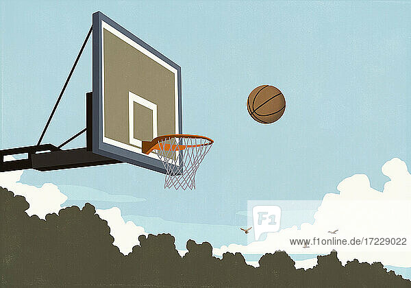 Basketball fliegt in der Luft zum Basketballnetz