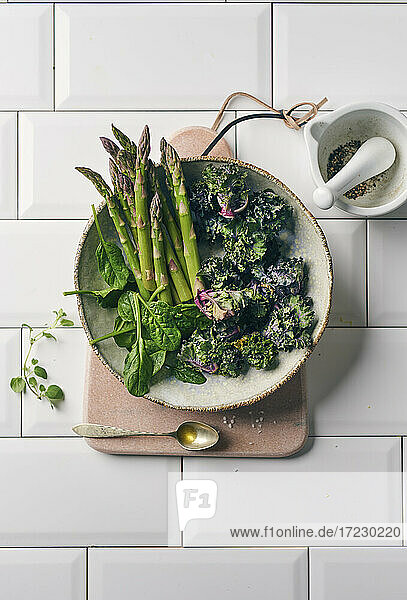 Mini asparagus  Flower Sprouts and spinach in a ceramic bowl