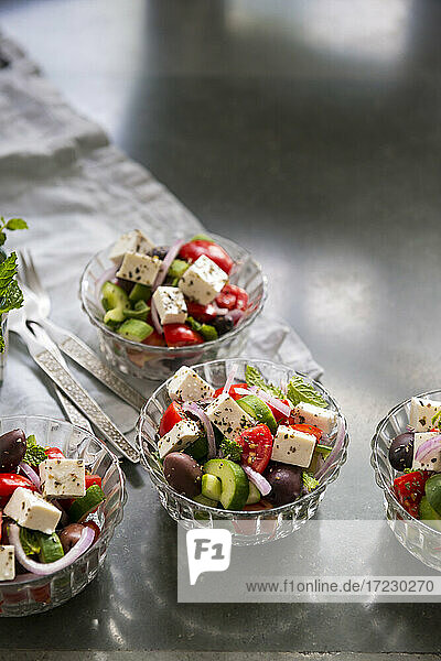 Traditional Greek salad in small glass bowls