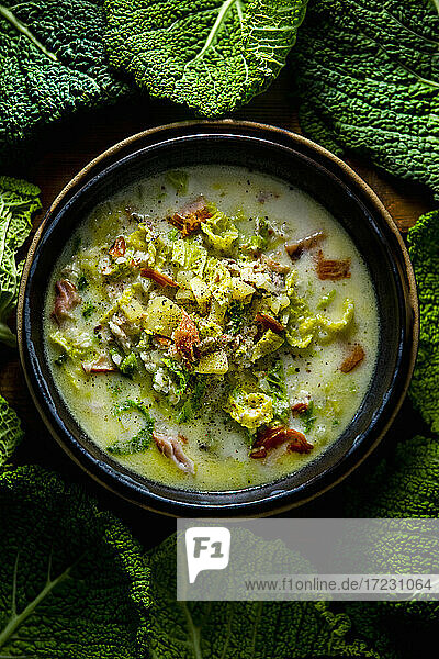 Portuguese smoked fish soup with savoy cabbage