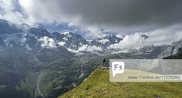 Hiker on the Tanzboden  behind Breithorn and Tschingelhorn  Lauterbrunnen  Bernese Alps  Bernese Oberland  Switzerland  Europe