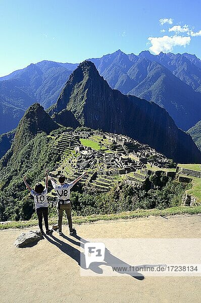 Two tourists wearing T-shirts with Love on them in the ruined city of the Incas  Machu Picchu  Urubamba Province  Peru  South America