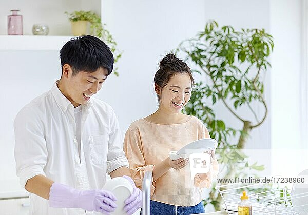 Young Japanese couple in the kitchen
