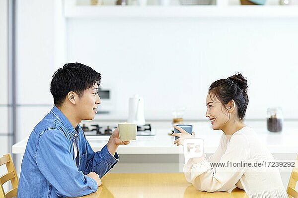 Young Japanese couple in the kitchen