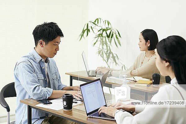 Japanese businesspeople working in the office