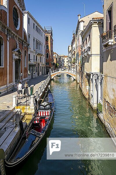 Venetian gondola in canal  Venice  Veneto  Italy  Europe