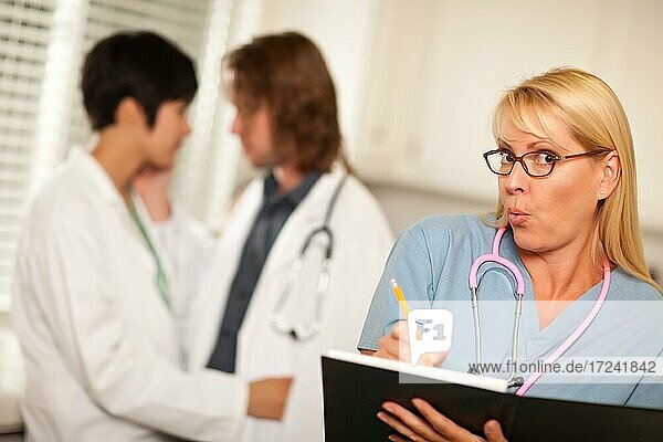 Alarmed medical woman witnesses her colleagues inner office romance display
