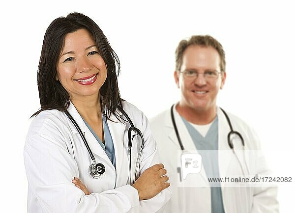 Friendly hispanic female doctor and male colleague before a white background