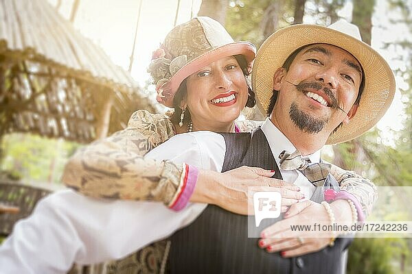 Attractive 1920s dressed romantic couple flirting outdoors