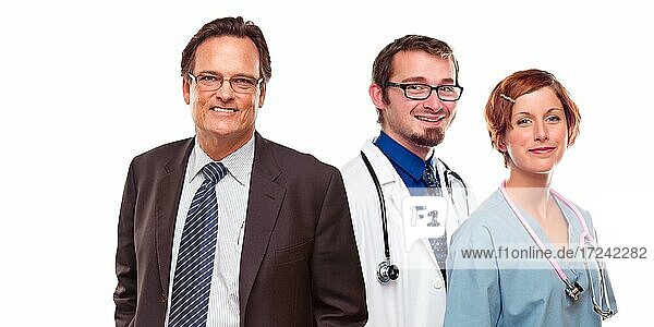 Friendly young male and female doctors with businessman before a white background
