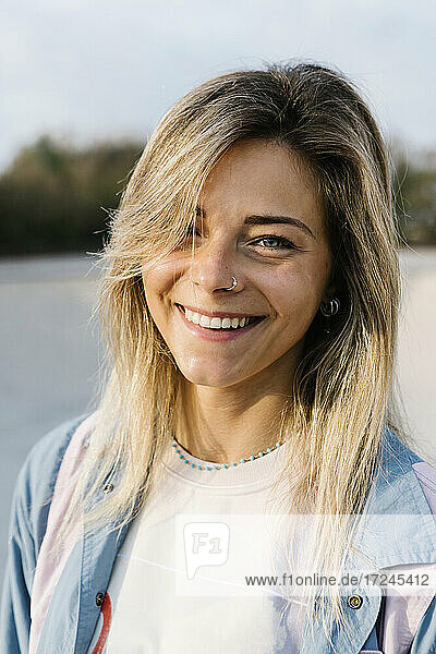 Beautiful woman wearing nose ring in skateboard park