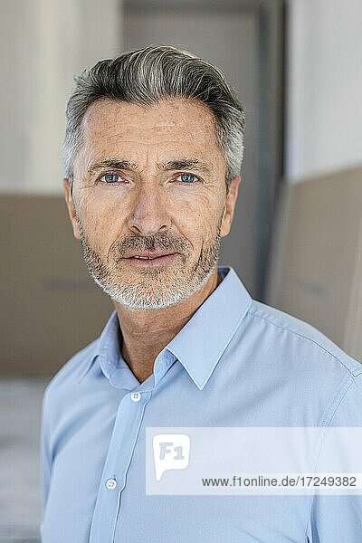 Male architect with gray eyes at construction site