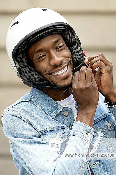 African man wearing crash helmet
