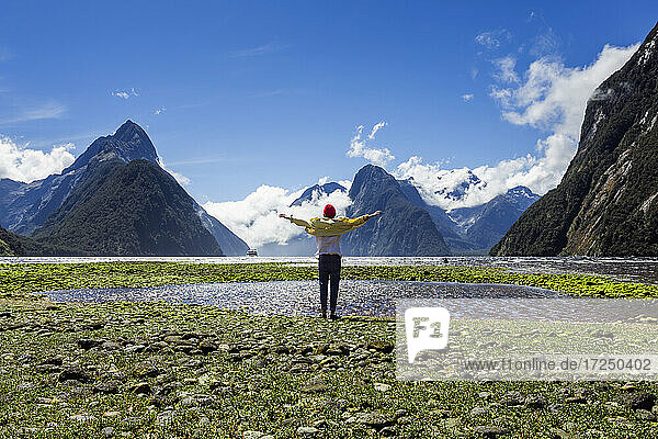 New Zealand  South Island  Milford Sound  Tourist enjoying mountain view