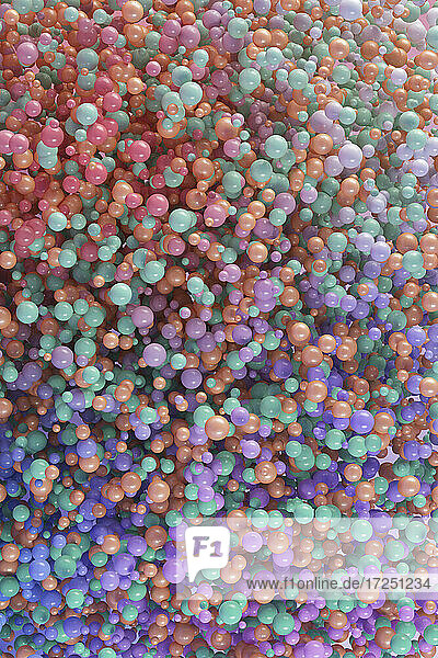 Dreidimensionales Rendering eines Haufens von pastellfarbenen Kugeln