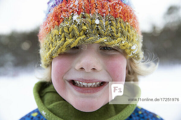 Cute boy with red cheeks during winter