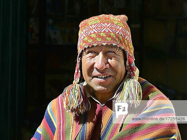 Indigenous man in colorful poncho and cap  portrait  Chinchero  Cusco region  Urubamba province  Peru  South America
