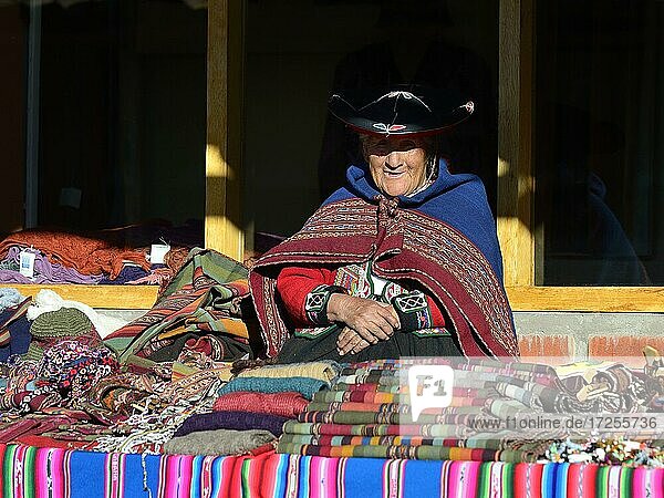 Indigenous old woman in traditional traditional costume in a souvenir cooperative  Chinchero  Cusco region  Urubamba province  Peru  South America