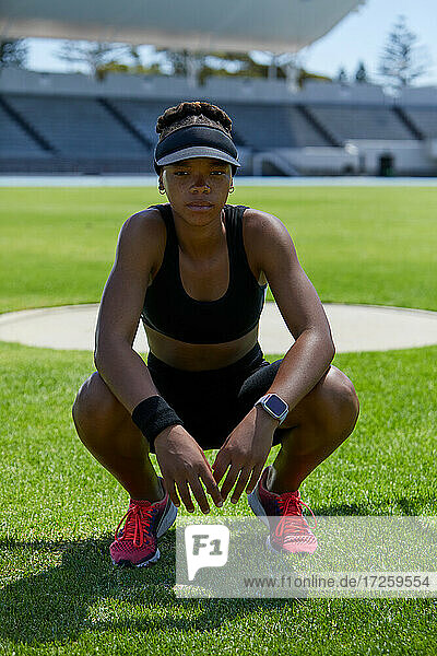 Portrait confident determined female track and field athlete