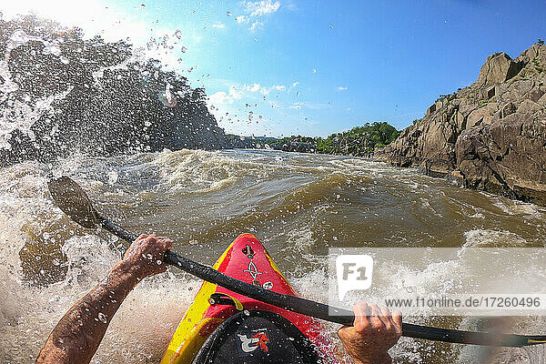 Photographer Skip Brown surfs his kayak on a whitewater wave on the Potomac River  border of Virginia and Maryland  United States of America  North America