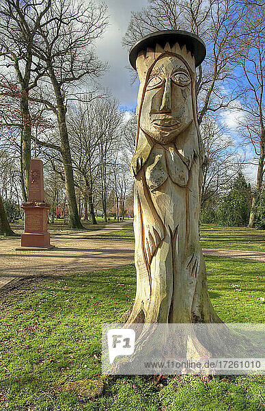 Wooden sculpture and war memorial in the castle park of Gemmingen in Kraichgau,  Heilbronn County,  Baden-Württemberg; Southern Germany,  Germany,  Europe.