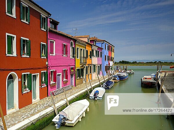 Canal with boats  Colorful houses  Colorful facades  Burano Island  Venice  Veneto  Italy  Europe