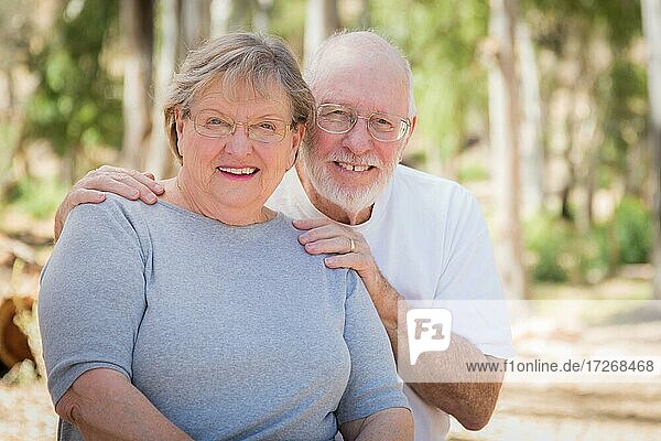 Happy senior couple portrait outdoors at park