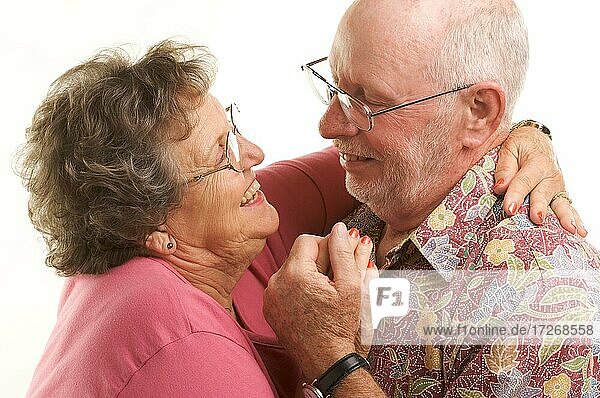 Happy senior couple romantically dancing