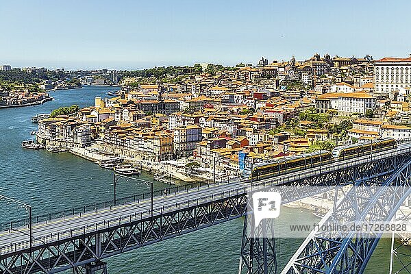 Beautiful panorama of city of Porto with metro on famous bridge  Portugal  Europe