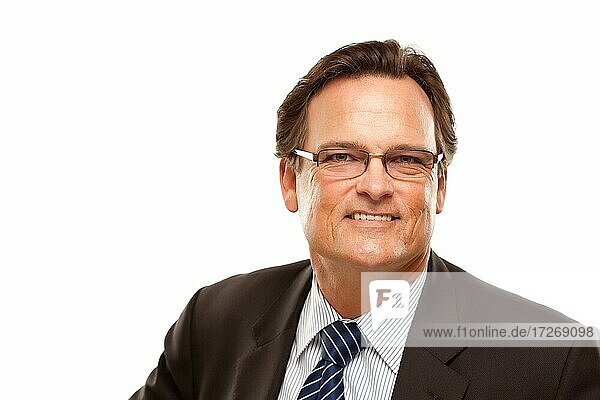 Handsome businessman smiling in suit and tie isolated on a white background