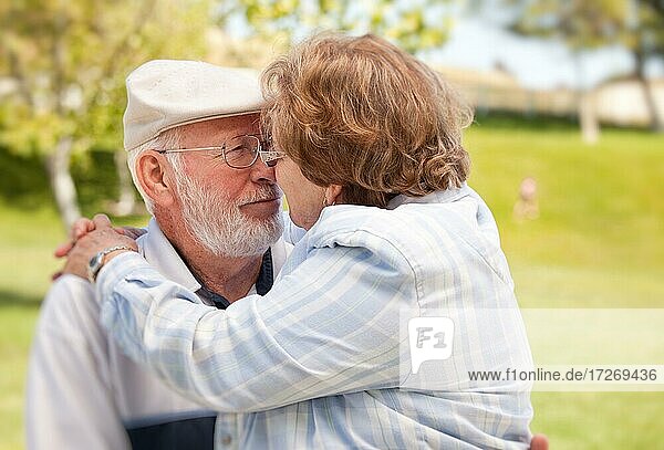 Happy senior couple enjoying each other in the park