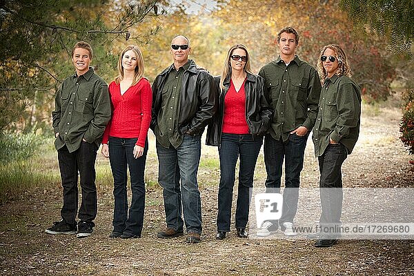 Happy attractive family standing portrait outdoors