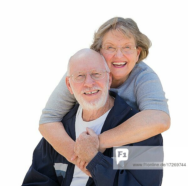 Happy loving senior couple hugging and laughing isolated on a white background
