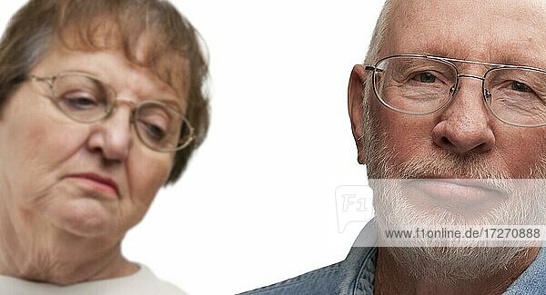 Melancholy senior couple isolated on a white background