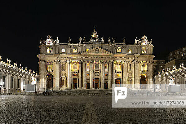 Illuminated St. Peter's Basilica and St. Peter's Square at night  Vatican City  Rome  Italy