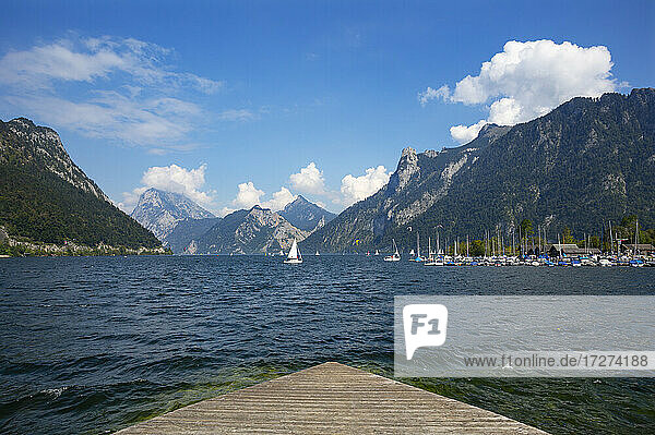 Austria  Upper Austria  Ebensee  Slipway on shore of Traunsee lake with boats and mountains in background