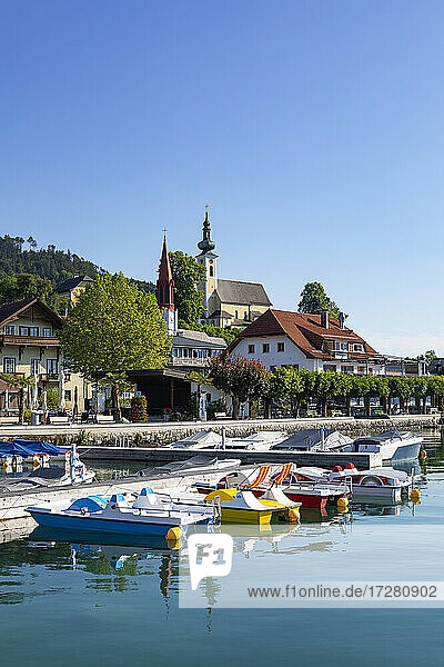 Austria  Upper Austria  Attersee am Attersee  Pedal boats moored in marina of lakeshore village in summer