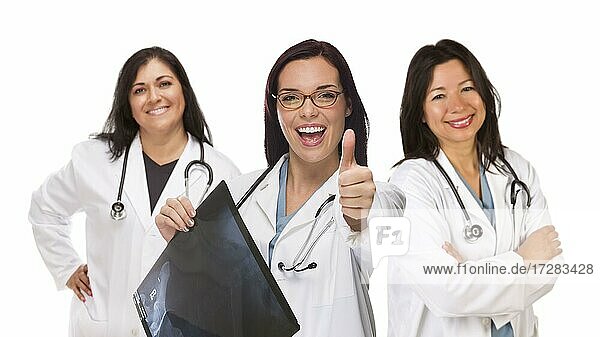 Three hispanic female doctors or nurses with thumbs up holding x-ray isolated on white