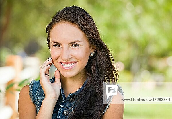 Attractive mixed-race girl portrait outdoors
