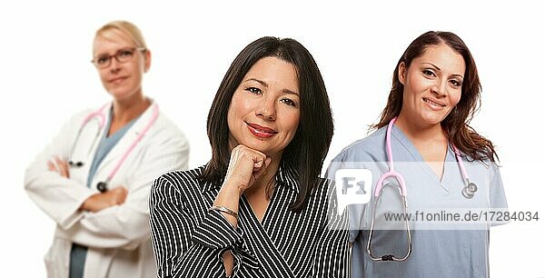 Hispanic woman with female doctor and nurse isolated on a white background