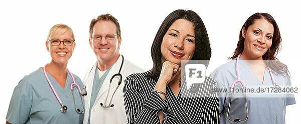 Hispanic woman with male and female doctor or nurse isolated on a white background